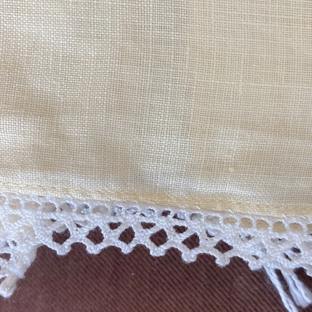 One fine linen embroidered tea towel. A muted butter yellow Vintage 1960s